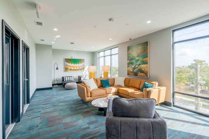 Community lounge space with comfortable seating for residents to study or relax in
