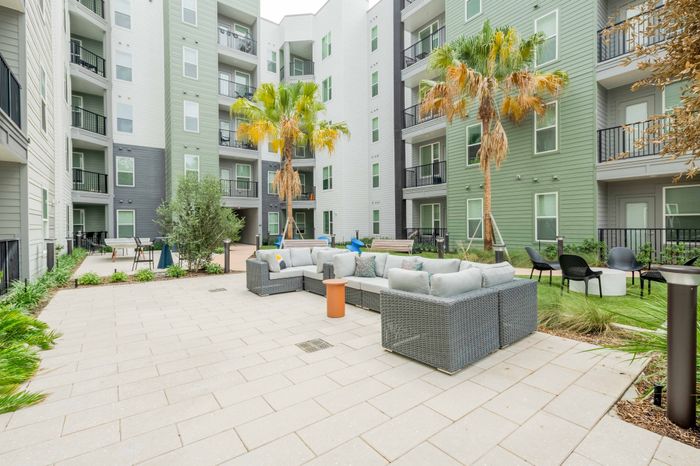 Outdoor courtyard with comfortable seating for residents to relax