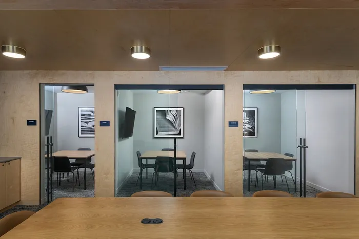 Private study room nooks with seating and tvs at The Accolade modern Seattle apartments.