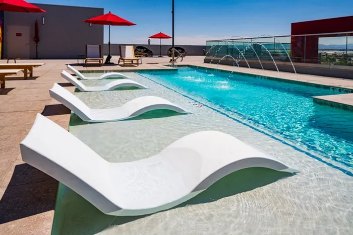 Pool with lounge seating in water