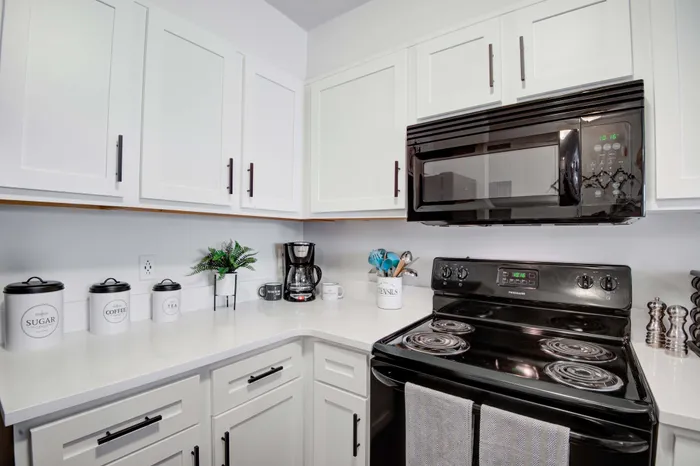 Unit kitchen with black appliances