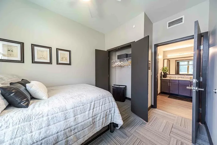 Bedroom with light grey comforter