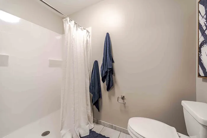 Bathroom with white shower curtain