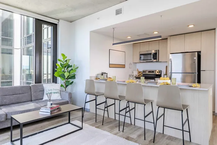 Modern kitchen and living space at The Accolade apartments in Seattle.