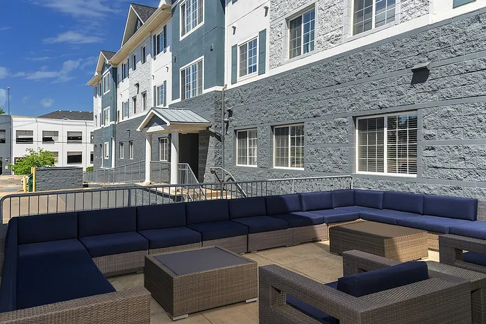 Study and co-working space with booths and wall art at Campus Village apartments near Michigan State University.