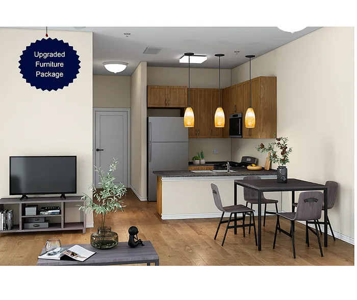 Chic open-plan kitchen and living area with upgraded furniture package, featuring warm lighting, modern appliances, and stylish decor.
