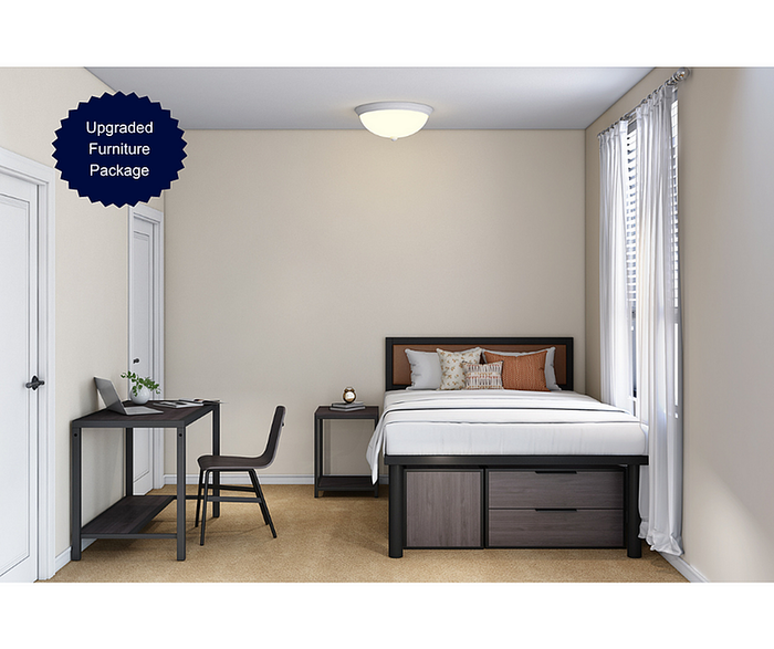 Bright modern bedroom with upgraded furniture package, featuring a stylish bed with integrated storage, sleek desk, and plush carpeting.
