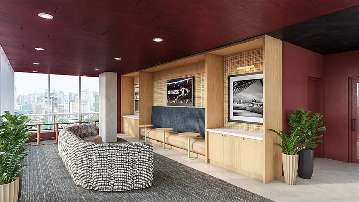 Chic and modern lounge area with stylish decor, large windows overlooking cityscape, plush seating, and vibrant artwork.