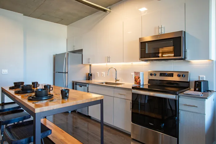 Modern kitchen with stainless steel appliances at Sora apartments for rent in downtown Phoenix, AZ.