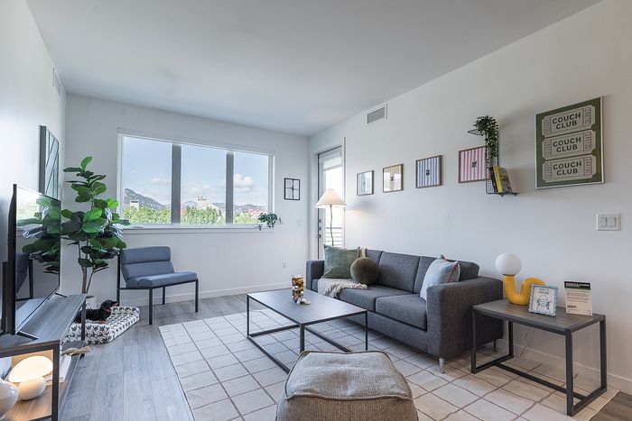 Bright and modern living room with large windows in our apartments in Boulder at Union 9Seventy.