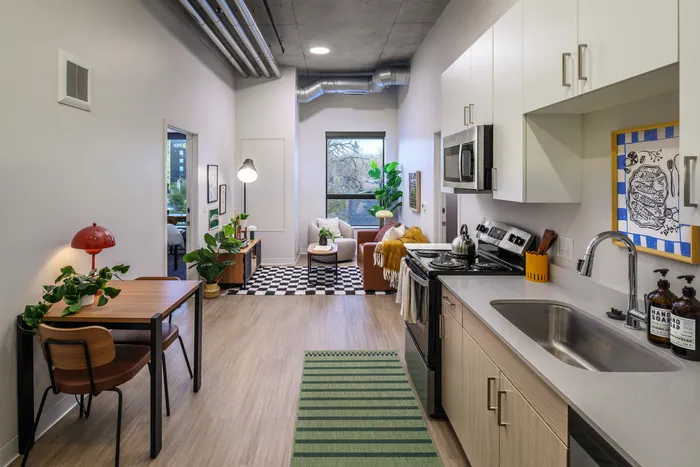 Chic urban apartment with a stylish kitchen, modern living area, and vibrant decor, perfect for city living.
