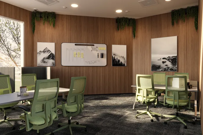 Modern office space with stylish green chairs, wooden walls, and a whiteboard surrounded by serene landscape artwork.