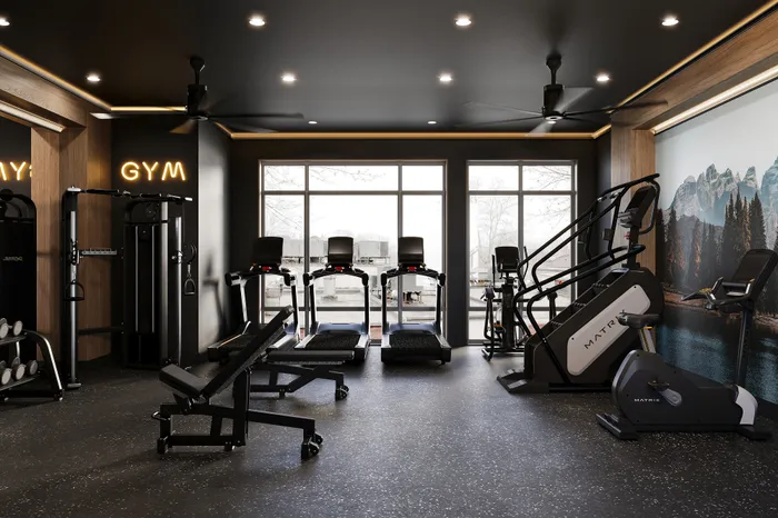 Modern gym interior with state-of-the-art equipment, stylish lighting, and scenic window views.