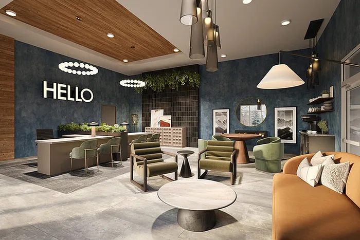 Chic apartment lobby with modern seating, lush greenery, and inviting decor under elegant lighting.