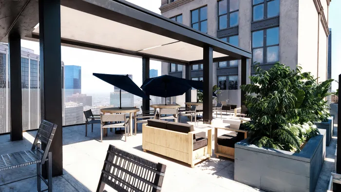 Rendering of a modern rooftop patio with stylish seating, lush greenery, and panoramic city skyline views.