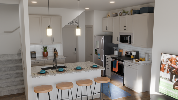 Modern kitchen with elegant pendant lighting, stainless steel appliances, and a cozy breakfast bar with wooden stools. Perfect for entertaining and culinary adventures.