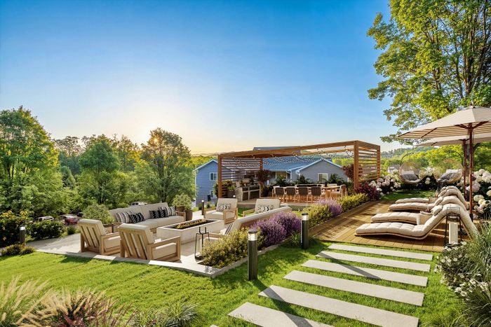 Virtually staged luxurious outdoor patio with stylish seating, lush greenery, and a serene sunset view, perfect for relaxation and entertainment.