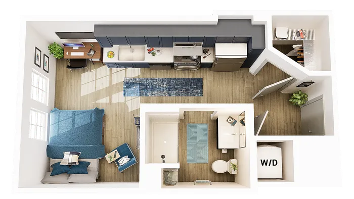 Modern open-concept studio apartment featuring a spacious kitchen with blue cabinetry, cozy bedroom area, chic home office setup, and stylish bathroom.