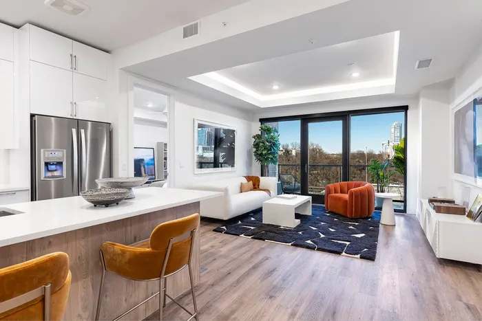 living room open to kitchen with skyline views