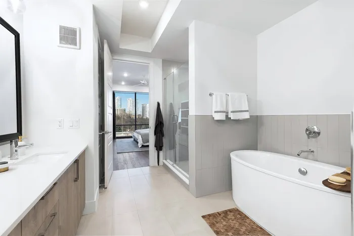 Standalone tub | framed mirrors | custom tile