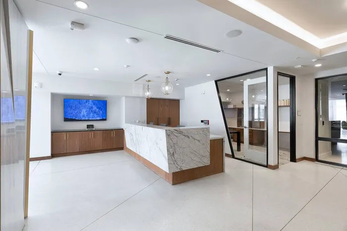 Lounge | Leasing Desk and Artwork | 1155 Barton Springs