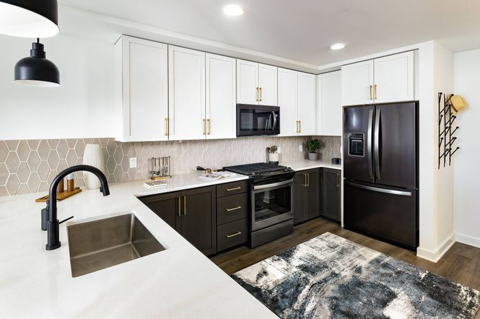 Kitchen with Gas Range Stovetops and Stainless Steel Appliances
