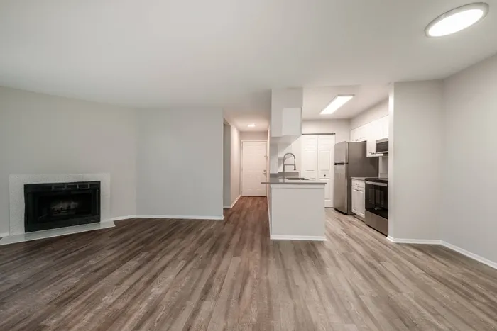 renovated living and kitchen space with fireplace