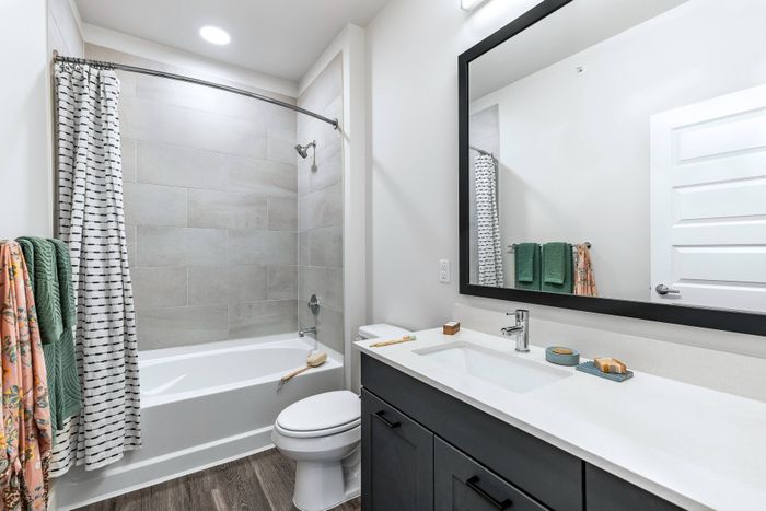 Modern apartment bathroom with spacious vanity and contemporary finishes at Perch Apartments in South Austin.
