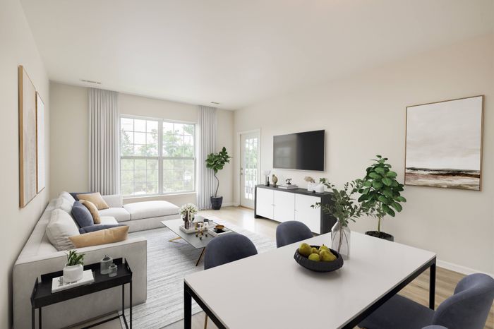 Sophisticated living area leading out to balcony in an Ossining apartment for rent.