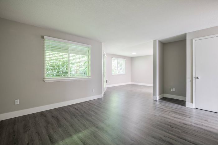 vacant renovated living and dining rooms