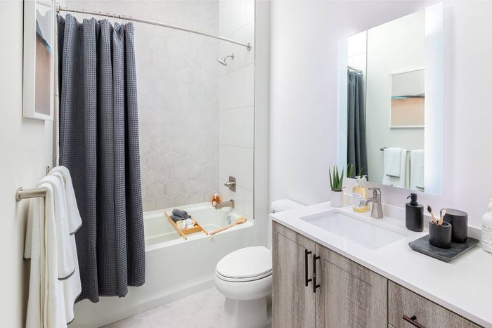 Bathroom with Quartz Countertops and Hexagon Tile