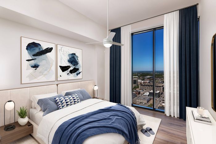 Spacious Penthouse Bedroom with Floor-to-Ceiling Windows