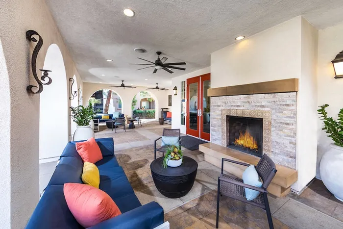 Outdoor resident lounge with a fireplace