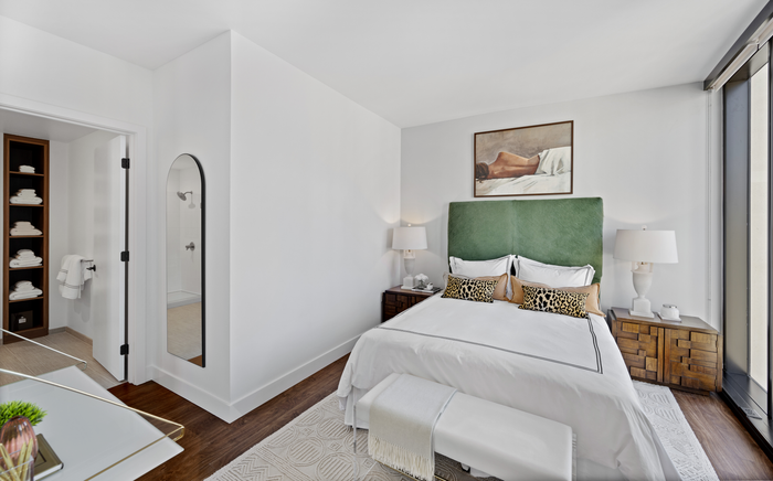 Spacious bedroom with floor to ceiling windows