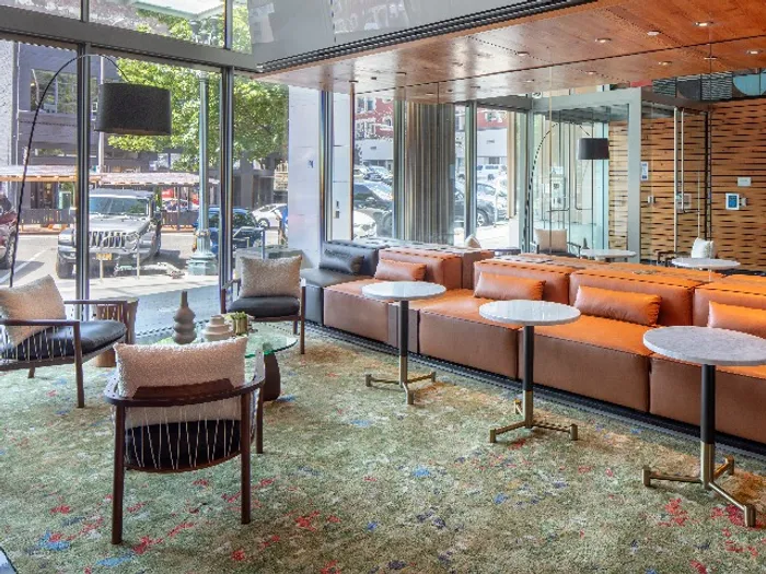 Seating area with a community bar inside a luxury apartment building in the pearl district of Portland.