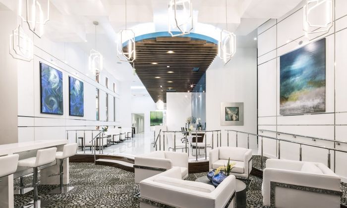 Resident lounge at our apartments for rent in Atlanta, GA, featuring cushioned chairs and modern decor.