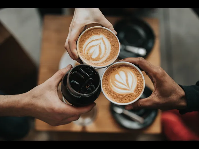 people cheering with drinks