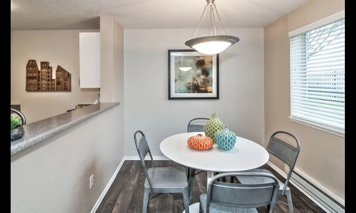 Dining area with small table and 4 chairs