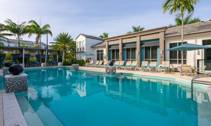 Pool with a sunset view outside the Franklin Delray apartments.