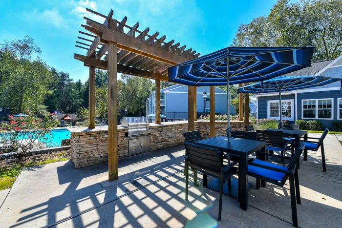 Luxury pool with grills outside apartments in Alpharetta, GA