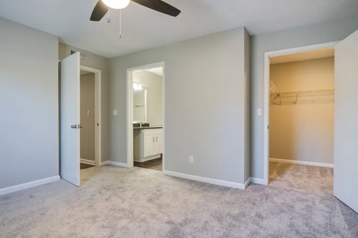 Primary bedroom's private bathroom and walk-in closet