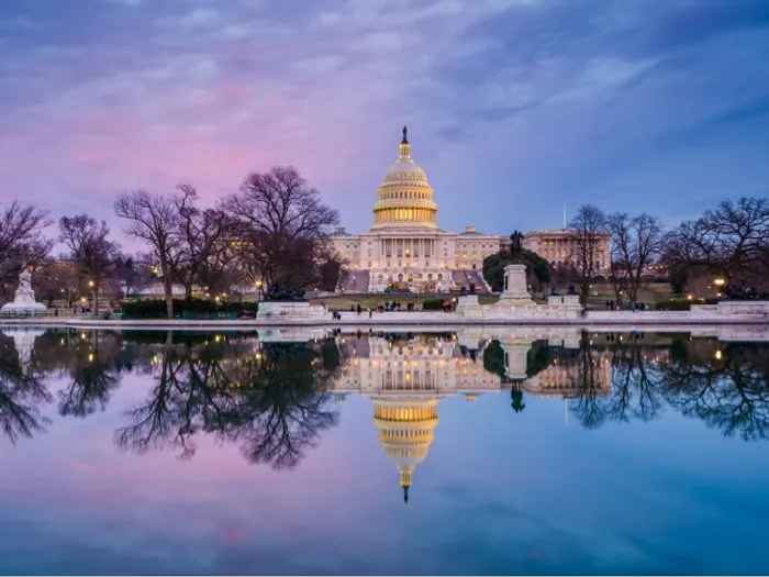 The Capitol Building and the reflecting pool at dusk, near our apartments for rent in Washington DC.