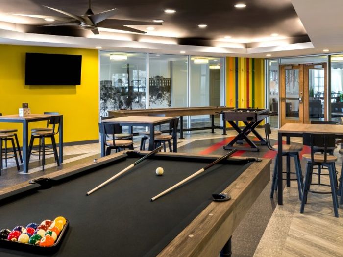 The resident lounge at our apartments for rent in Washington DC, featuring ample seating and a billiards table.