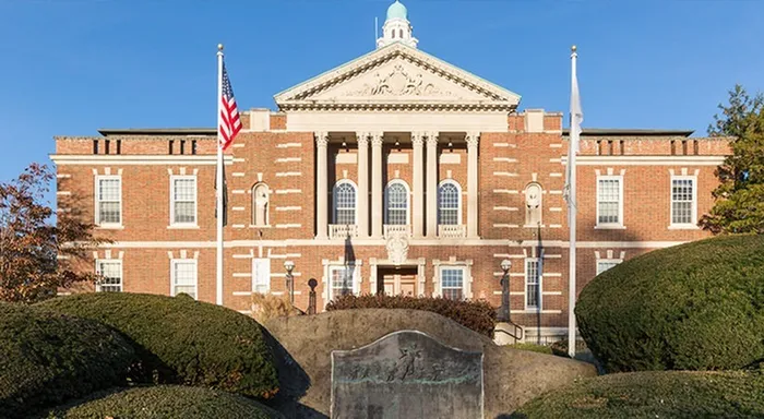 Historic building near our apartments for rent in Watertown, MA, featuring a stately brick facade with columns.