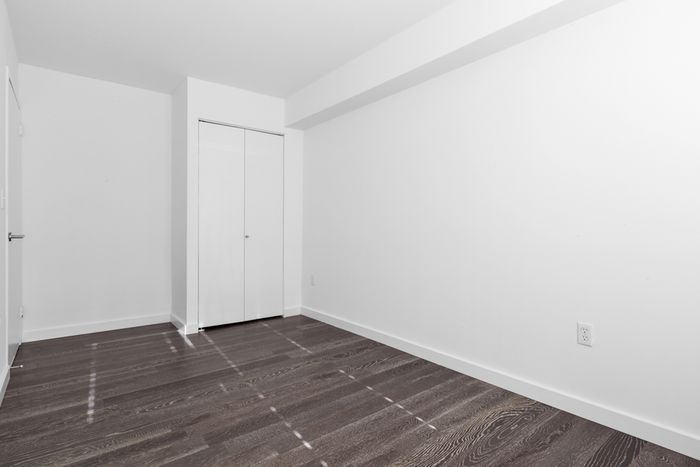 Large bedroom with dual-door closet