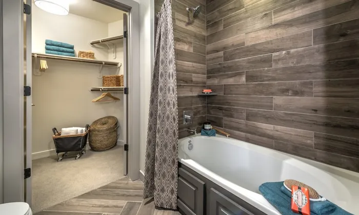 luxurious bathroom with large closet