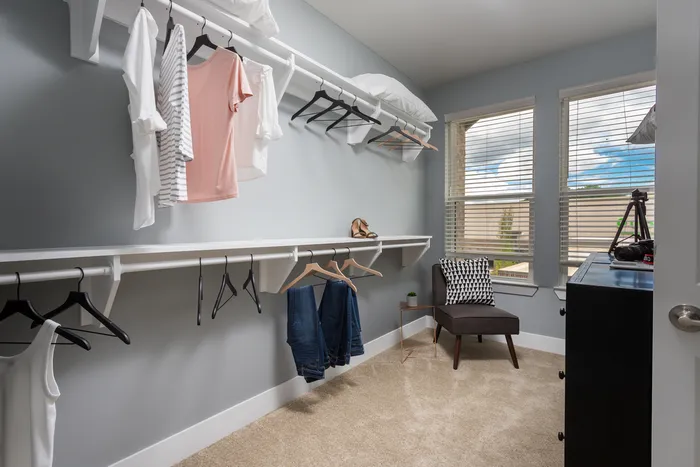 Large walk in closet with windows