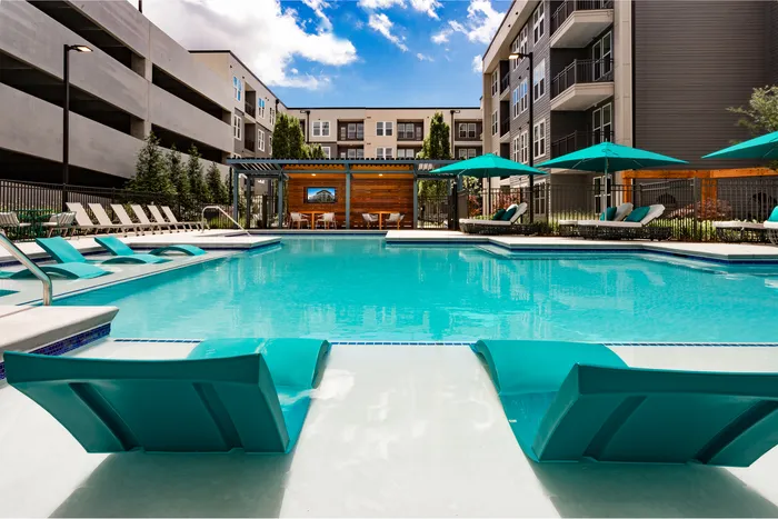 Pool lounge seating and umbrellas