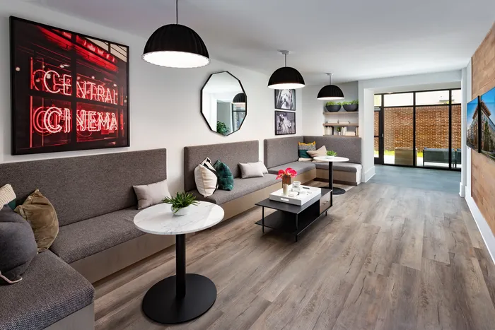Clubhouse media room with seating and large tv