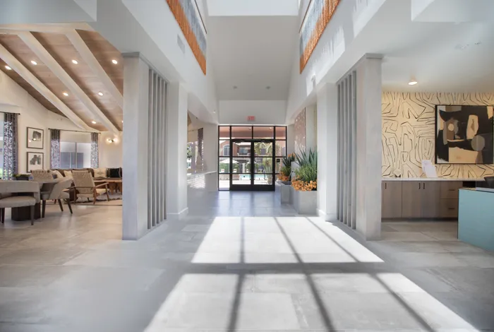 Halway within the community center leading to front door.